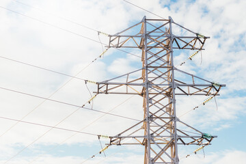 Photo of Electricity Power line technology voltage over sky background.
