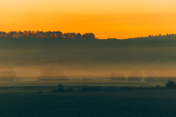 Beautiful morning landscape before sunrise in rural space, vibrant colors.