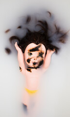 Submerged Doll in Cloudy Bath Water