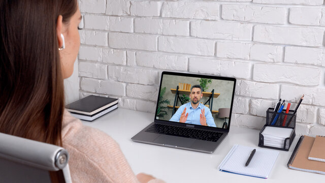 Man Tutor In Computer Screen Talk Speak Teaches By Remote Webcam, Distance Education Learning. Woman Student Study At Home Office Online By Conference Video Call Chat Laptop Listen Teacher Trainer