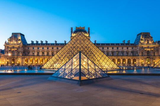 Paris, France - June 18, 2015: night scene of the Louvre Pyramid in Paris. It is a large glass and metal pyramid designed by architect I.M. Pei