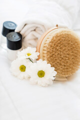 spa and beauty threatment products with white towel