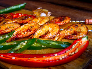 grilled prawns with garlic and vegetables.