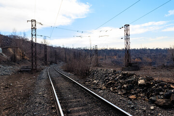 Fototapeta na wymiar Railroad track in the iron ore quarry