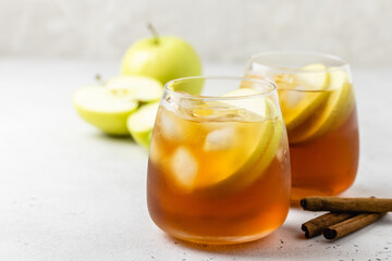 Summer mocktail, apple honey iced tea in glasses. Space ofr text.
