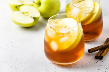 Cinnamon apple iced tea in glasses. Space ofr text.