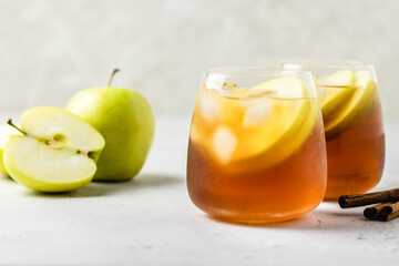 Cinnamon apple iced tea in glasses. Space ofr text.