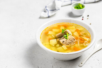 Canned tuna, noodles fish soup in a bowl. Space for text.