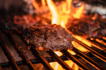 steel grilled meat burger with wood flame fries in metallic foil herbs oregano cordoba argentina