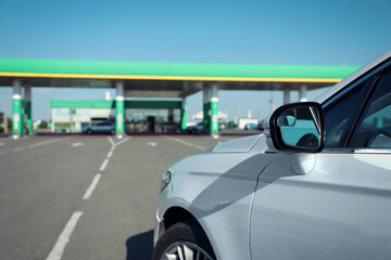 Modern car driving to gas station, closeup
