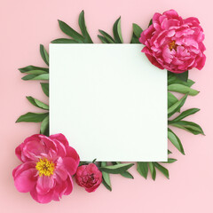Pink peony flowers and empty paper for text. Birthday, celebrataion, invitation concept. Top view.