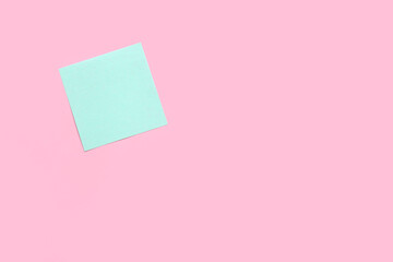 blue pastel sticky note on pink background