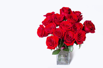 Fototapeta premium Bouquet of red (burgundy) roses on a white background. Place for text. Close-up.