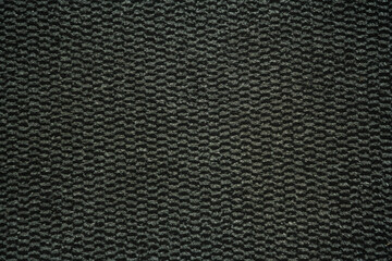 Fototapeta na wymiar Black and grey carpet rug, texture / background, copy space or pattern.
