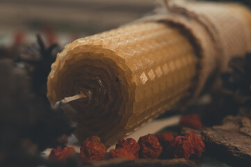 Wax candle close-up with focus on the upper edge of the candle and a slight blur