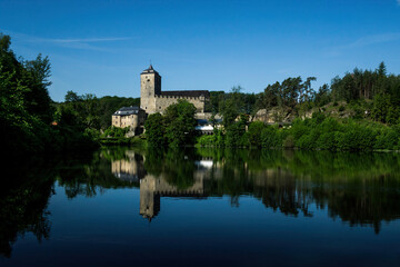 Fototapeta na wymiar gothic castle on the lake at sunny weather