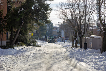 Snowplow machine clearing a street in Madrid