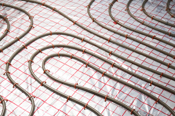Installation of underfloor heating system in building
