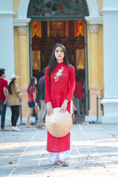 Portrait of Vietnamese girl traditional red dress,Beautiful young asian woman wearing Vietnam