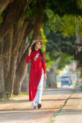 Portrait of Vietnamese girl traditional red dress,Beautiful young asian woman wearing Vietnam