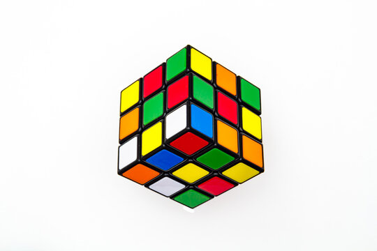 Saint-Petersburg, Russia - JULY 17, 2019 : Rubik's cube, rubik's cube top view isolated, rubik's cube on white background, colorful puzzle, math problem, charging for your brain, cube rainbow palette