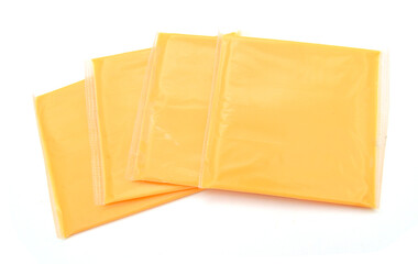 Slices of processed American cheese on white background