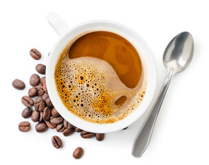 Cup with coffee, coffee beans and spoon on white background, isolated. Top view