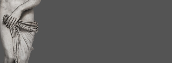 Banner with ancient marble statue with beautiful body lines of a young Roman Italian or Greek woman of Renaissance Era at solid grey background with copy space. © neurobite
