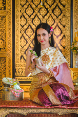 Fototapeta premium Luxury portrait of a beautiful Thai girl in traditional thai costume, identity culture of Thailand, identity culture of Asia