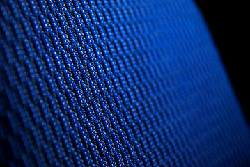 Closeup on blue upholstery in sport car. Structure of the material