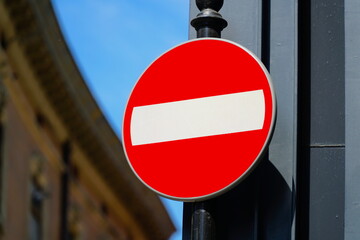 Red no entry traffic sign isolated on background street, road with road sign prohibiting.