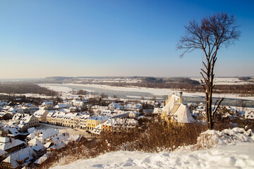 View on Kazimierz Dolny in winter. Sunny day, blue sky. Lubelskie Voivodeship