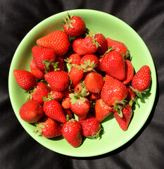 Red and fragrant strawberries to taste without anything or with sugar and lemon