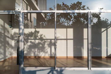 light and shadow from sunlight on wall . Modern building interior background..