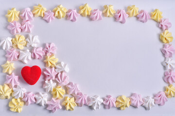 frame made of colored marshmallows on a white background