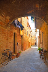 A residential alley in the historic medieval village of Buonconvento, Siena Province, Tuscany, Italy
