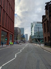 City street in Manchester City centre with buildings in the background. 