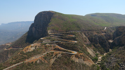 The road up Lebo Pass, Serra da Leba pass, Angola, snaking road up the mountain with many twists and turns. - obrazy, fototapety, plakaty