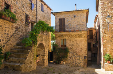 An historic stone residential building in the village of Montemerano near Manciano in Grosseto province, Tuscany, Italy
