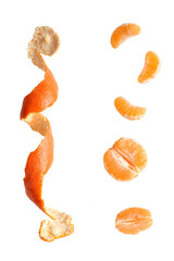 Bright tangerine on a clean background. Tangerine slices. Peeled tangerine. Citrus in flight. Mandarin peel