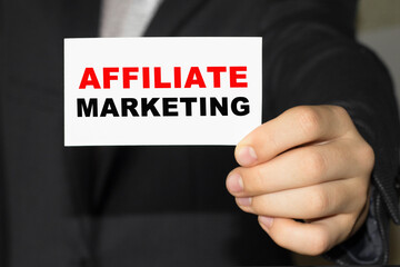 Card with text AFFILIATE MARKETING on hand. You can use in business, marketing and other concepts. Messege of the day.