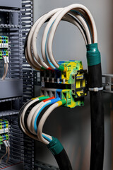 Connections of colored wires in the electrical cabinet. Automatic control systems for electricity. Insulation with heat shrink tubing.