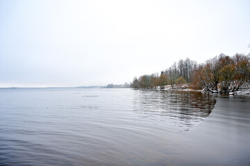 Landscape with winter lake and trees