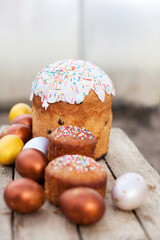 Sweet Easter cake on  wooden  table and colorful easter eggs