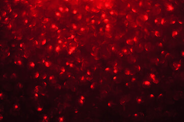 Red sparkling defocused light on black background, Red bokeh, abstract background stock photo,...