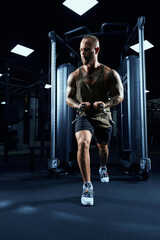 Fototapeta premium Muscular bodybuilder doing crossover chest exercise.