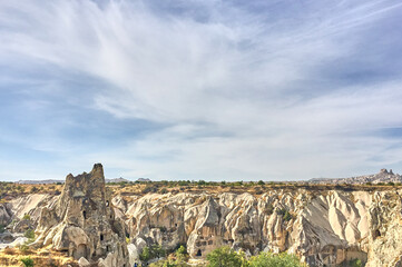 Ancient cave houses  and rock formations near Goreme, Cappadocia, Turkey