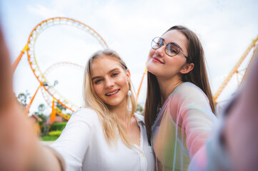 LGBT concept, Young women at Amusement theme park enjoying, Smiling multiethnic women enjoying and fun, Diversity, tolerance and gender identity concept, Valentine's Day