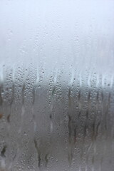 Vertical background of condensation on transparent glass with high humidity