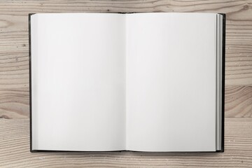 Open blank notebook on a wooden desk